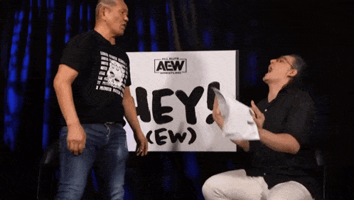 two men are fighting with one holding a piece of paper and the other has glasses on