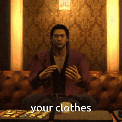 a man sitting on a couch with the words " your clothes " on the bottom