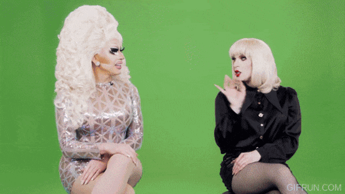 two drag queens are sitting next to each other on a green screen with gifrun.com in the corner