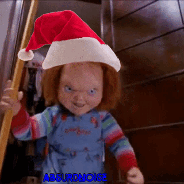chucky doll wearing a santa hat and holding a pole