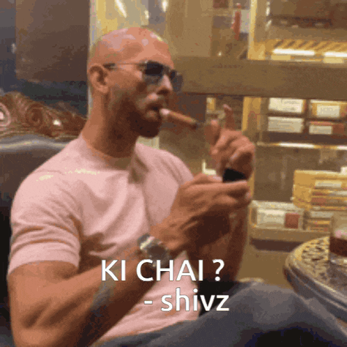a man wearing sunglasses is smoking a cigar and says ki chai