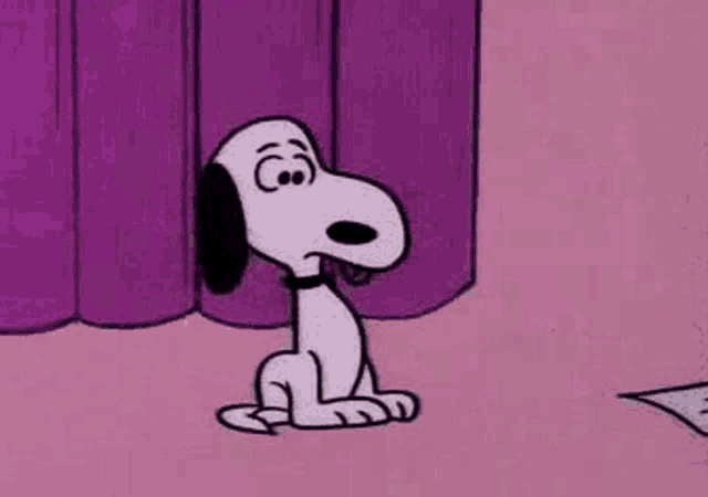 snoopy is sitting on the floor with his eyes closed .