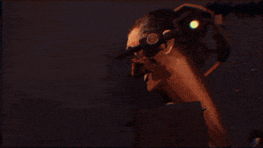a blurry image of a person 's face is displayed on a dark background