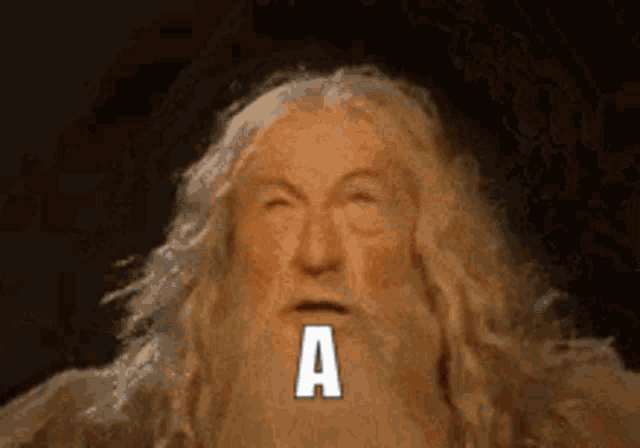 a man with a beard has the letter a written on his face .
