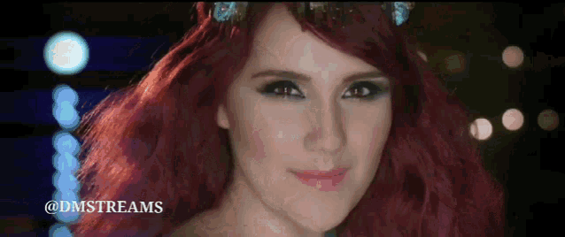 a close up of a woman 's face with the hashtag @dmstreams