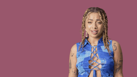 a woman stands in front of a pink background with the words excuse me on it