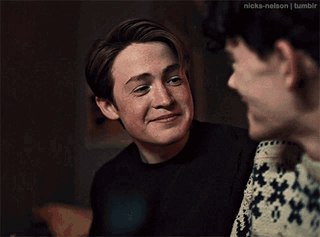 two young men are looking at each other with nicks-nelson tumblr written on the bottom right