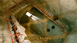 an aerial view of a staircase in a cave with the words `` begging for help '' .