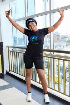a woman wearing a black t-shirt that says i am plus
