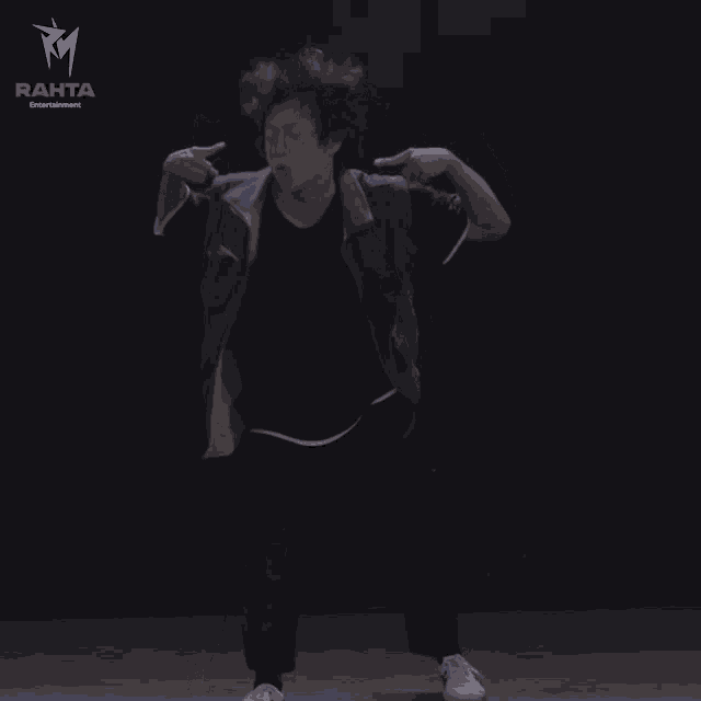 a person is dancing in front of a rahta entertainment logo