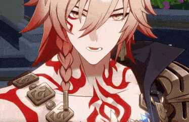 a man with a braided hair and a tattoo on his chest has the letter s on his chest