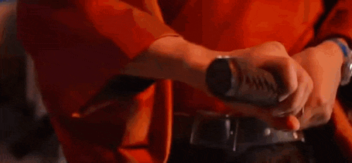 a close up of a person holding a lightning bolt .