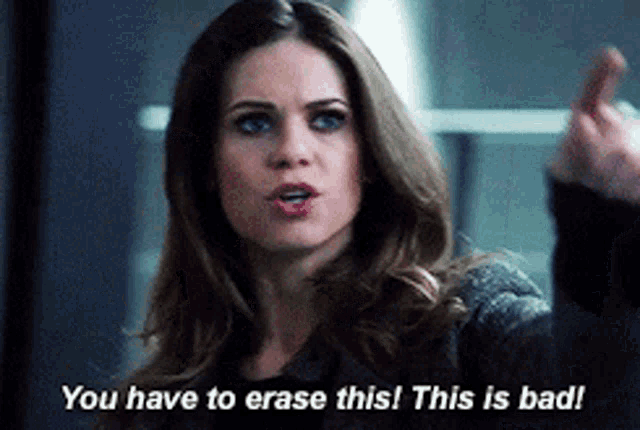 a woman is giving the middle finger and says " you have to erase this "