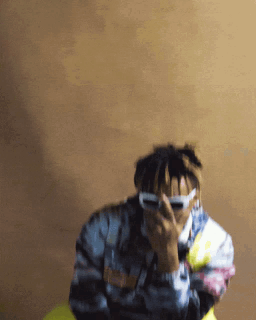 a blurry picture of a person wearing sunglasses