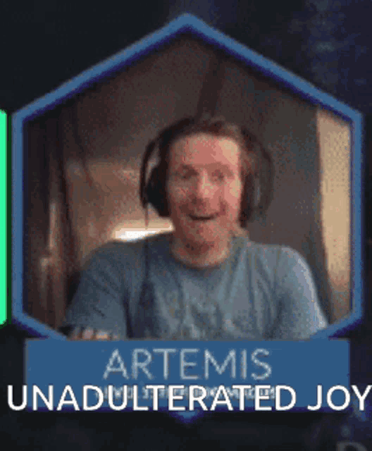 a man wearing headphones is smiling with the words artemis unadulterated joy above him