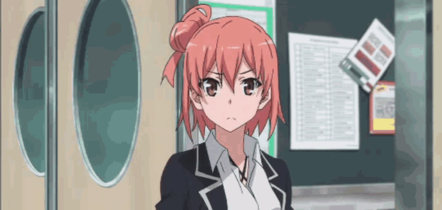 a girl with pink hair and a black suit is standing in front of a door