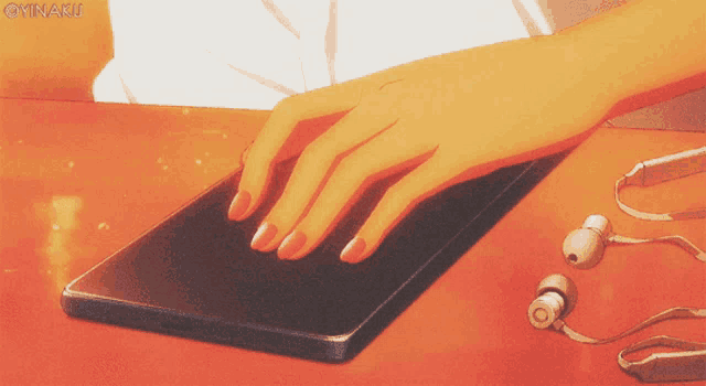 a person 's hand is pressing a button on a cell phone