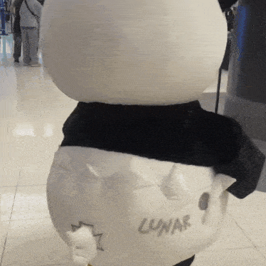 a stuffed animal with the word lunar written on it