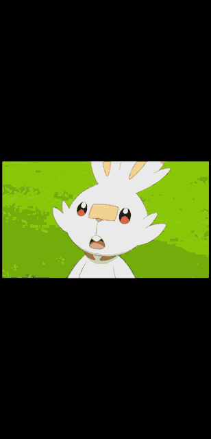 a cartoon rabbit is standing in the grass .