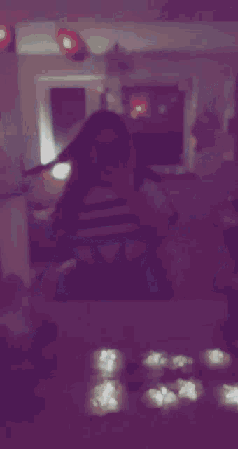 a person taking a selfie in front of a mirror with a striped shirt on