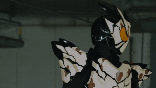 a close up of a person wearing a black and white robot costume