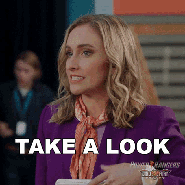 a woman is wearing a purple suit and a scarf and says take a look