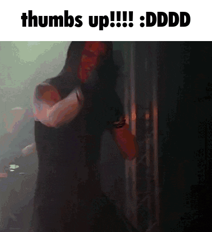 a man in a hooded top is giving thumbs up