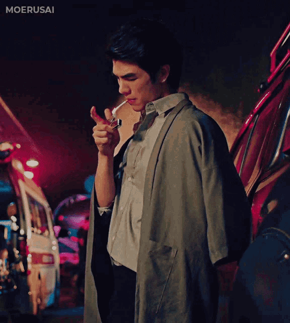a man is smoking a cigarette in front of an ambulance that says moerusai on the bottom right