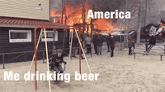 a child is sitting on a swing in front of a burning house while drinking beer .