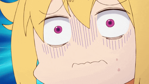 a close up of a girl 's face with a surprised expression