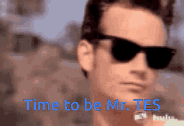 a man wearing sunglasses with the words time to be mr. tes behind him