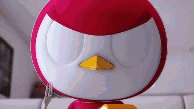 a red and white bird with a yellow beak holds a fork
