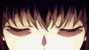 a close up of a person 's eyes with a tear coming out of their nose
