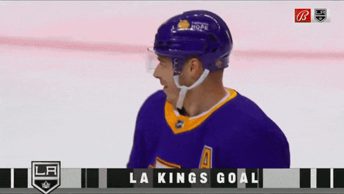 a hockey player wearing a purple jersey with the number a on it