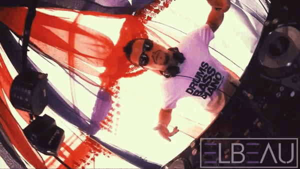 a man wearing a t-shirt that says drums bass and piano