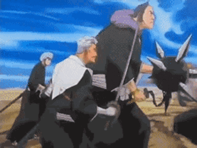 a group of people are standing in a desert holding swords and a sword .