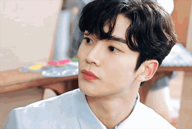 a close up of a young man 's face with the word jeon visible