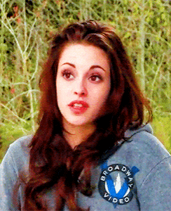 a woman wearing a gray broadway video hoodie