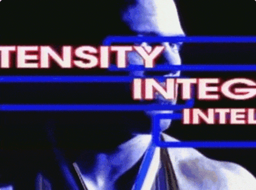 a man 's face is behind a blue screen that says tnsity integ intel