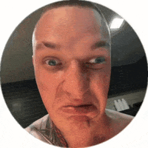 a man with a tattoo on his chest is making a funny face in a circle .
