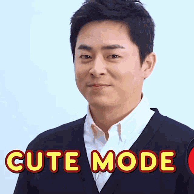 a man is wearing a black cardigan and a white shirt and the words cute mode are displayed above him