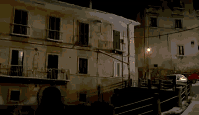 a building with a lot of windows and balconies is on fire