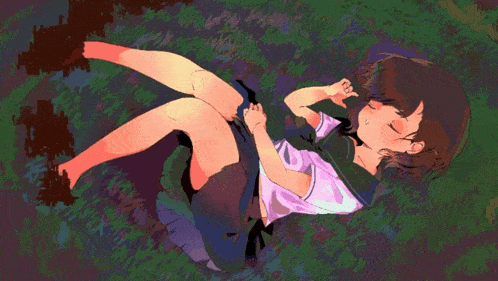 a girl laying in the grass with her eyes closed