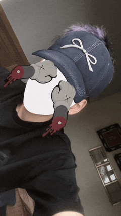 a man wearing a baseball cap with a bow on it