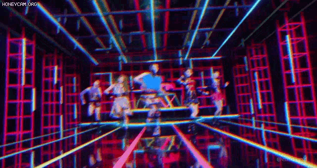 a group of people are dancing in a room with a lot of lights .