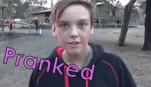 a boy with the word pranked written on his face