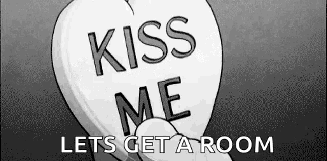 a candy heart that says `` kiss me lets get a room '' .