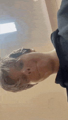 a close up of a person 's face with their eyes closed and their mouth open .