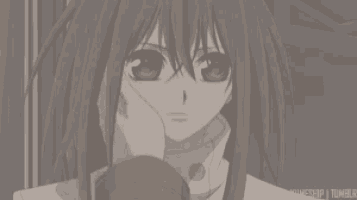 a black and white photo of a girl with red eyes holding a cup .