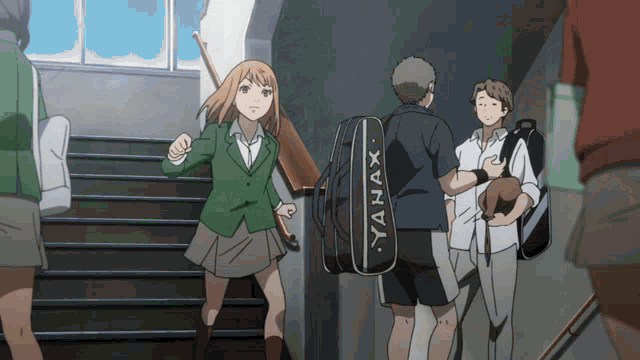a man carrying a badminton bag that says yanax on the side